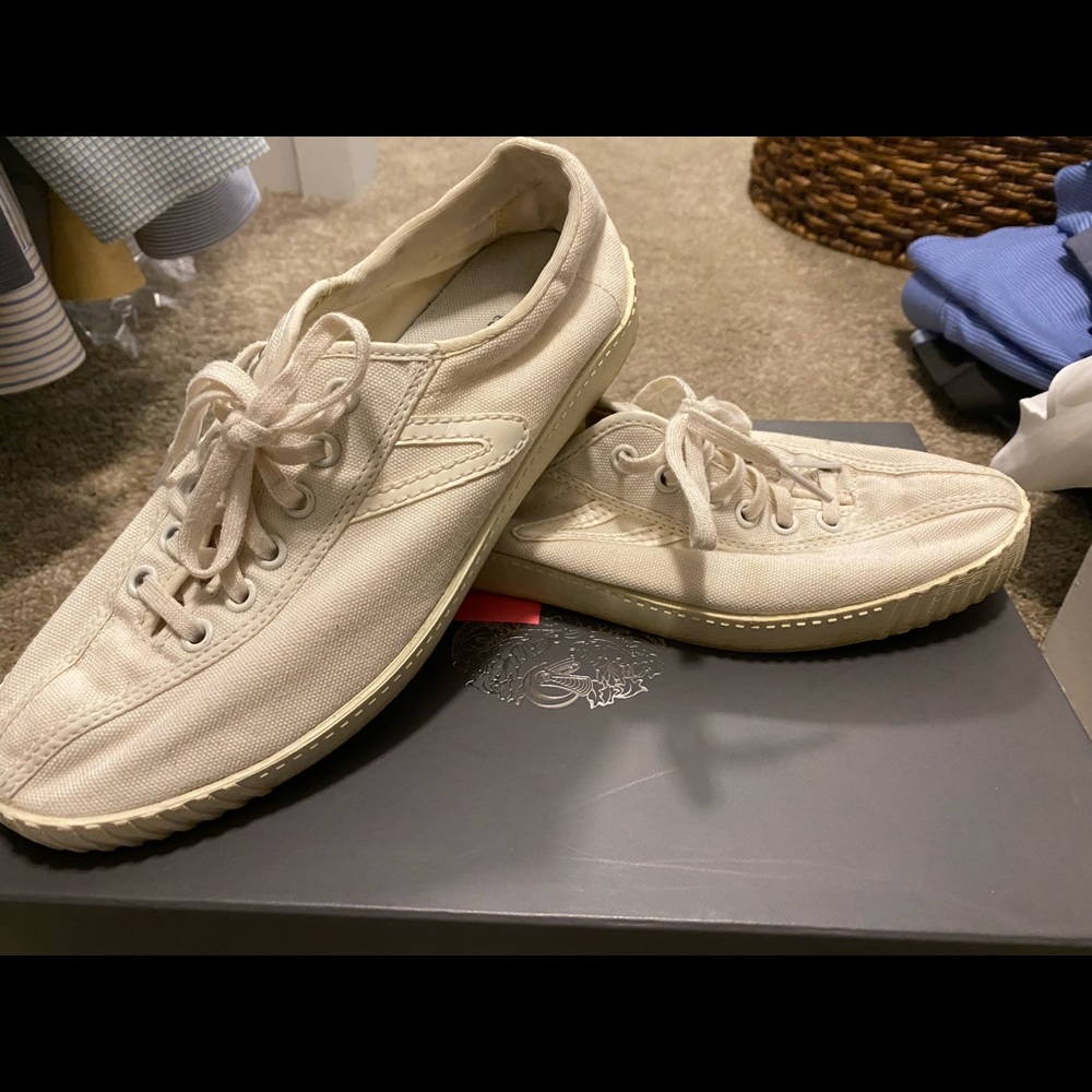 All white canvas Tretorn tennis shoes